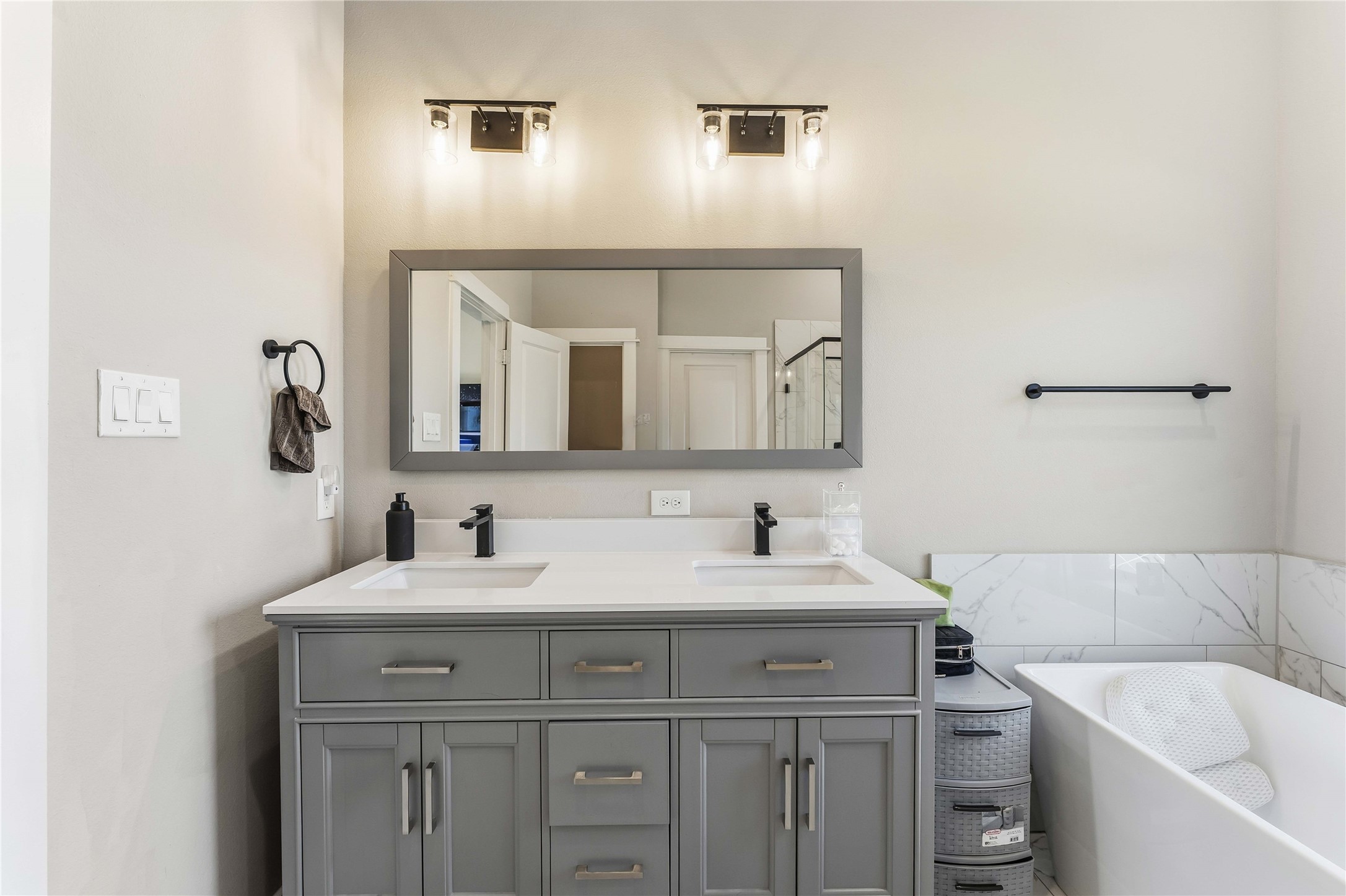 405 Stonework Garden Lane Houston, TX 77076 - Photo 12 of 23 a bathroom with a sink and a mirror