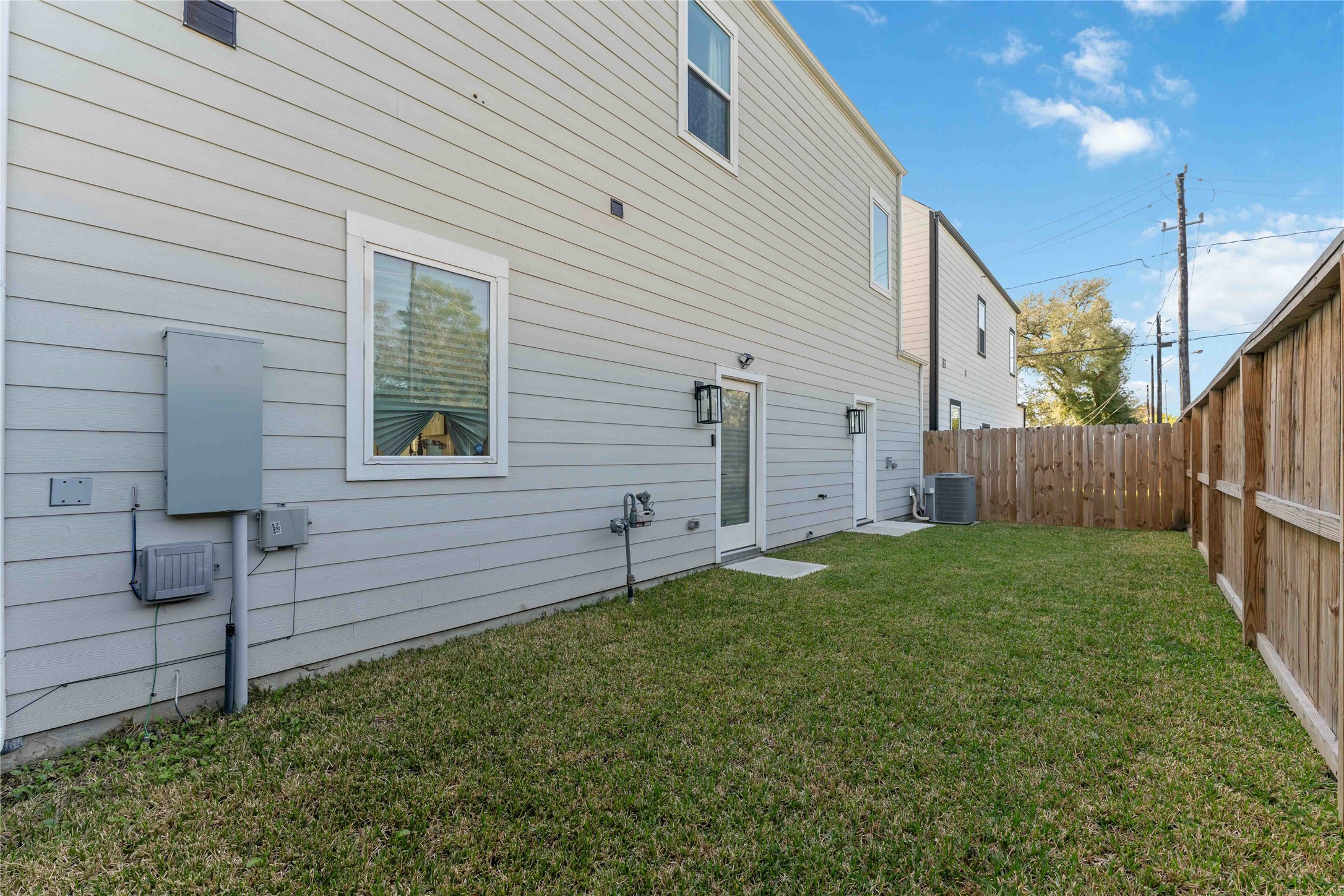 405 Stonework Garden Lane Houston, TX 77076 - Photo 23 of 23 a view of a backyard with wooden fence