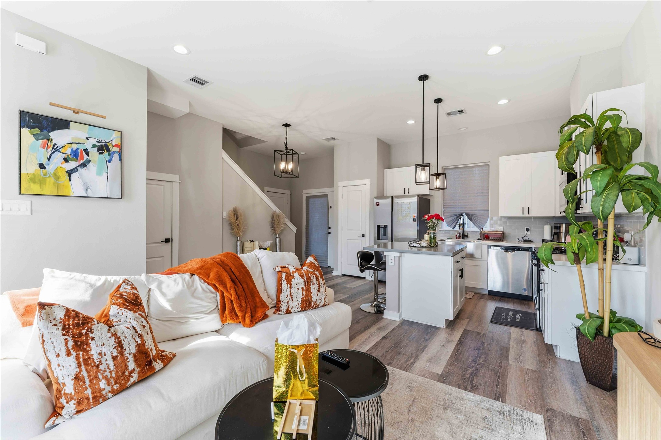 405 Stonework Garden Lane Houston, TX 77076 - Photo 4 of 23 a living room with furniture and a chandelier