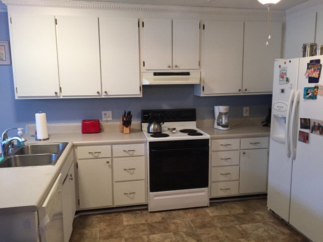 5798 Huddersfield Road Macon, GA 31210 - Photo 13 of 35 a kitchen with stainless steel appliances granite countertop a sink dishwasher a refrigerator and cabinets with wooden floor