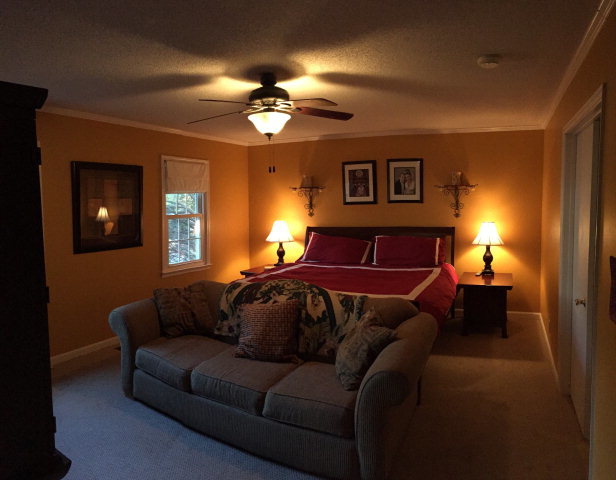 5798 Huddersfield Road Macon, GA 31210 - Photo 19 of 35 a spacious bedroom with a bed and a couch