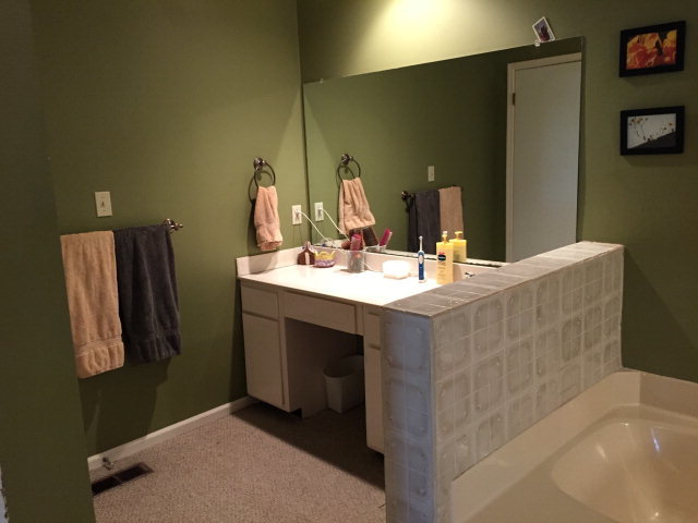 5798 Huddersfield Road Macon, GA 31210 - Photo 23 of 35 a bathroom with a sink and a mirror