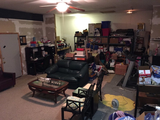 5798 Huddersfield Road Macon, GA 31210 - Photo 24 of 35 a living room with lots of furniture and clutter