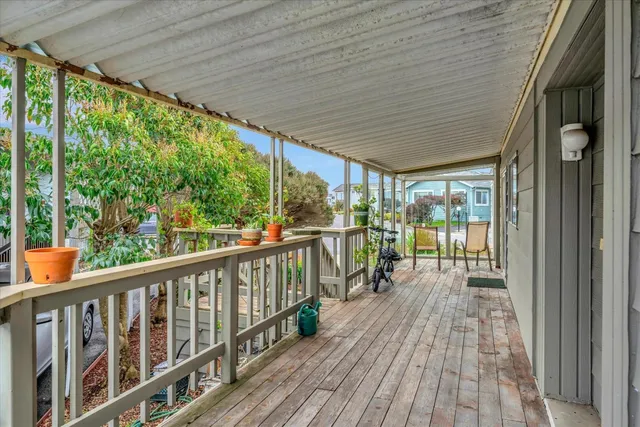 a view of a balcony with wooden floor