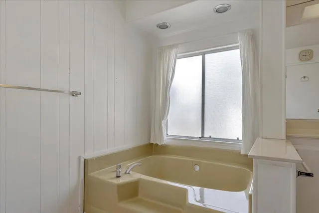 a bathroom with a shower and a shower