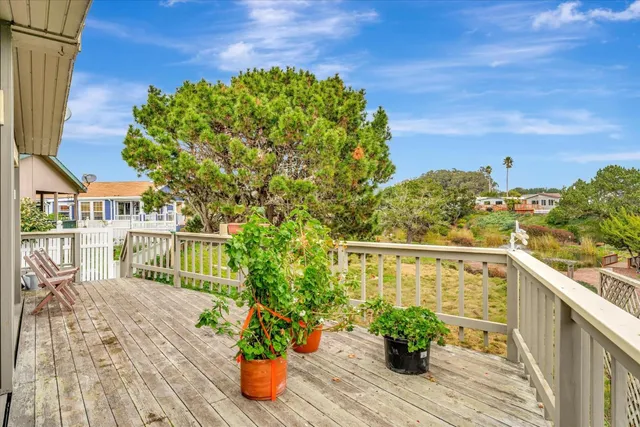 a view of a house with a yard patio and fire pit