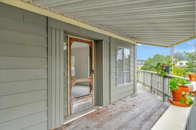 a view of a porch with furniture
