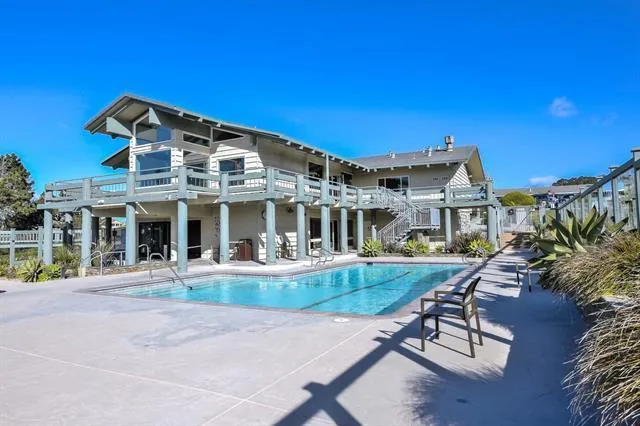 a view of a swimming pool with a patio