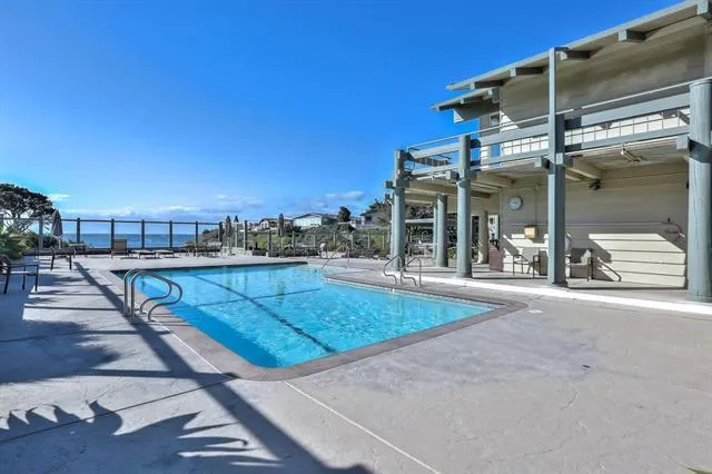 a view of a dining room with furniture wooden floor and chandelier