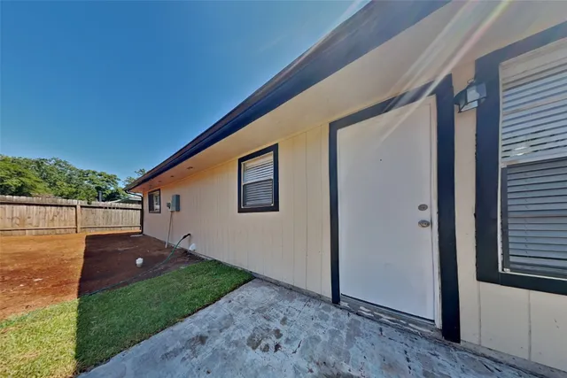 a backyard of a house with seating space