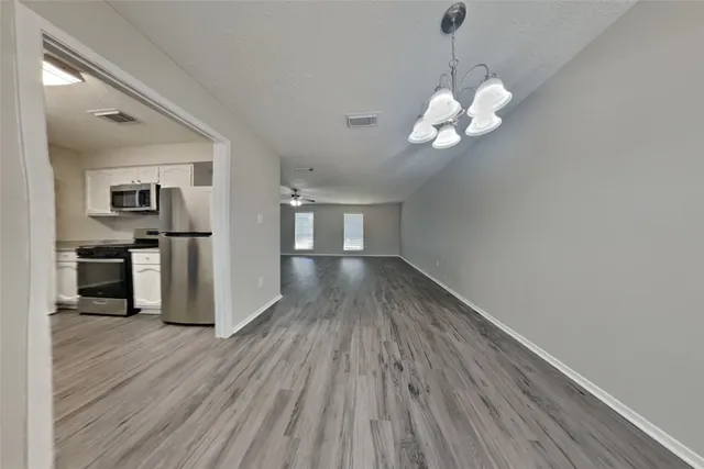 a view of a livingroom with wooden floor
