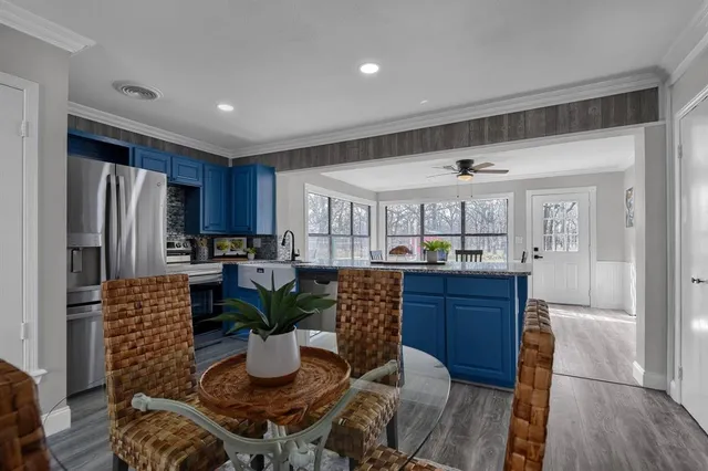 a kitchen with granite countertop a sink and a counter top space