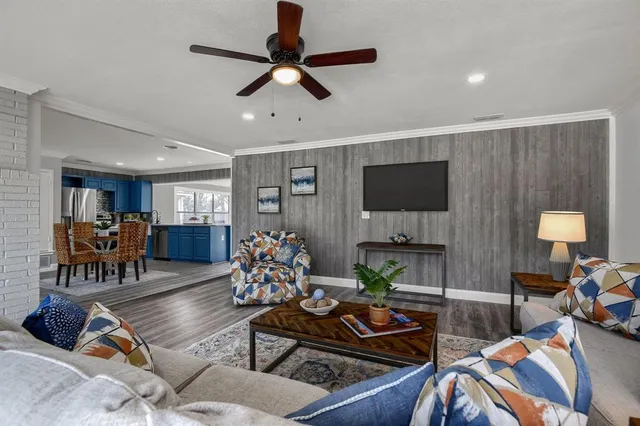 a view of a dining room with furniture and a kitchen