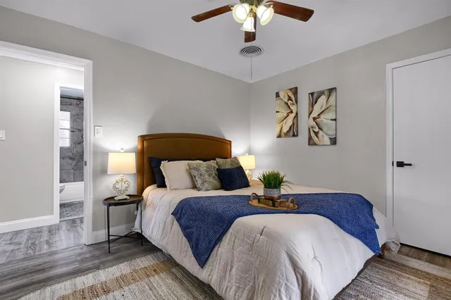 a bathroom with a sink a mirror a toilet and a shower