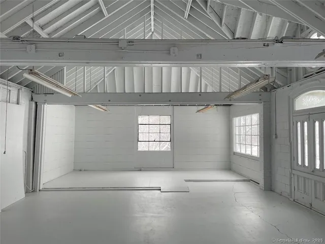 a view of a yard with trees in the background