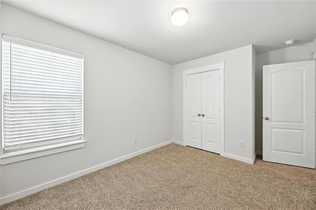 5019 Flanagan Drive Forney, TX 75126 - Photo 11 of 19 an empty room with a window