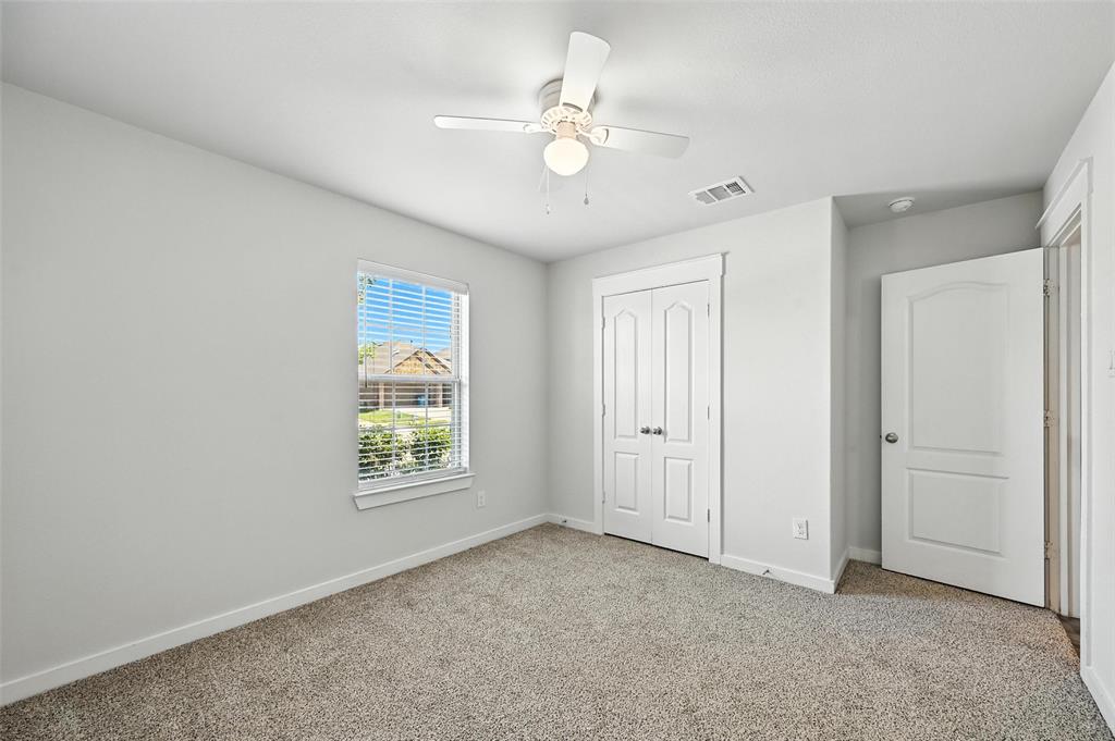 5019 Flanagan Drive Forney, TX 75126 - Photo 7 of 19 a view of an empty room with a window