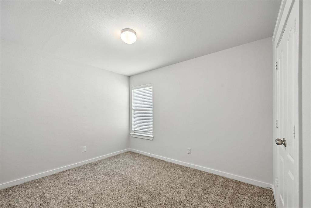 5019 Flanagan Drive Forney, TX 75126 - Photo 8 of 19 an empty room with windows