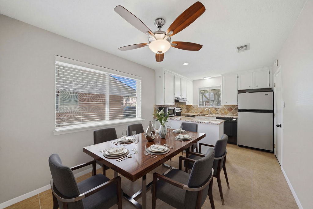 1408 Ramada Drive Houston, TX 77062 - Photo 12 of 28 a view of a dining room with furniture and a large window