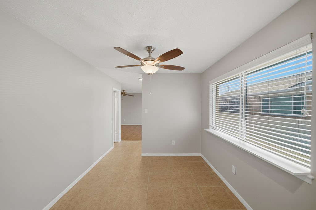 1408 Ramada Drive Houston, TX 77062 - Photo 14 of 28 a view of a livingroom with a ceiling fan and window