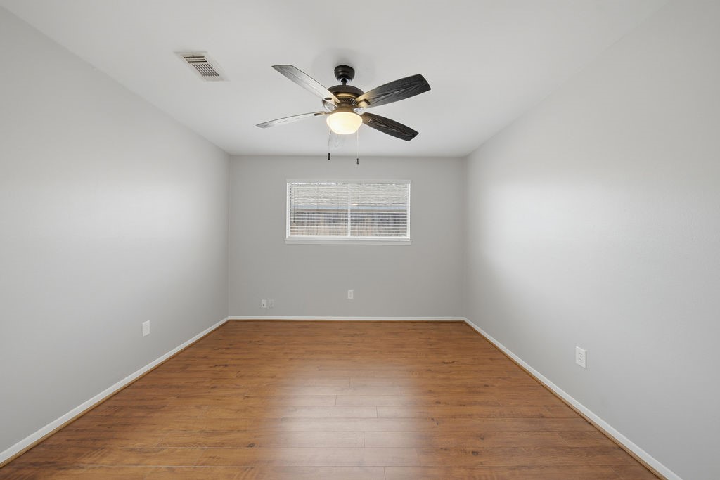 1408 Ramada Drive Houston, TX 77062 - Photo 19 of 28 wooden floor in an empty room with a window