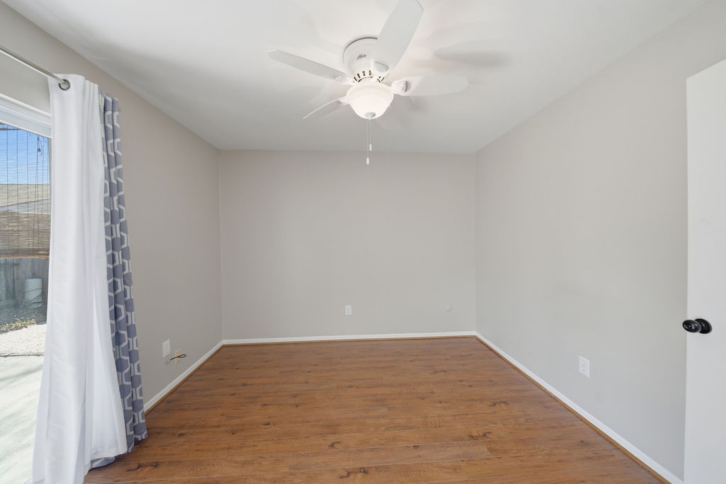 1408 Ramada Drive Houston, TX 77062 - Photo 22 of 28 a view of a room with wooden floor and fan