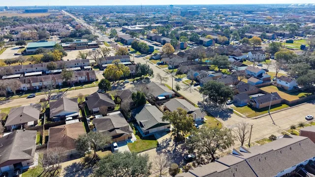 an aerial view of a city with lots of residential buildings