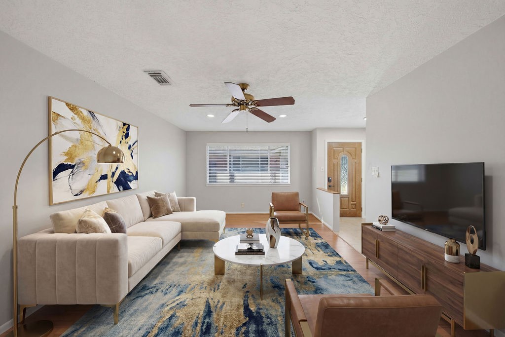 1408 Ramada Drive Houston, TX 77062 - Photo 6 of 28 a living room with furniture and a flat screen tv