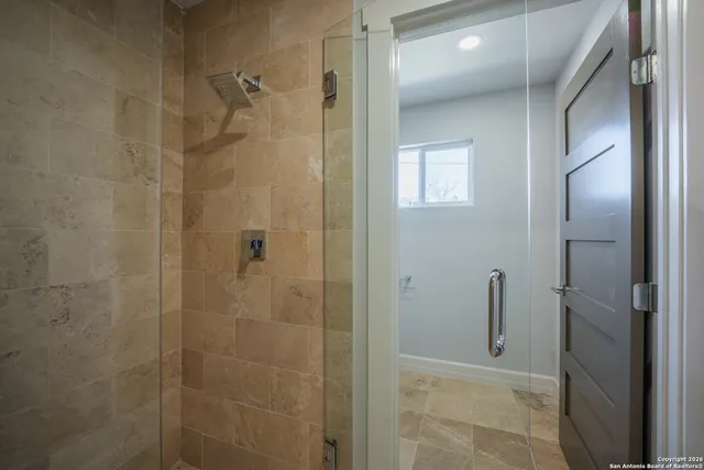a bathroom with a double vanity sink and mirror