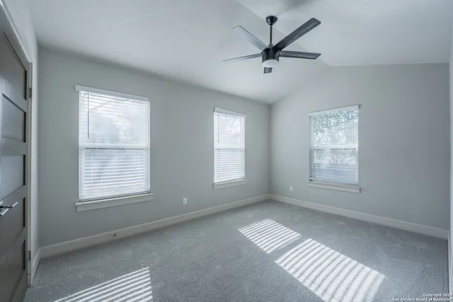 a view of an empty room with a window