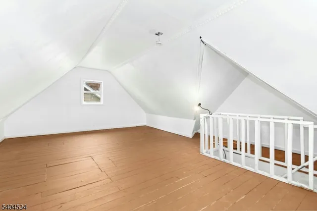 a view of an empty room with stairs