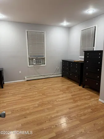 a room with a dresser and a mirror