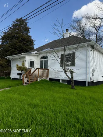 a front view of house with yard and porch