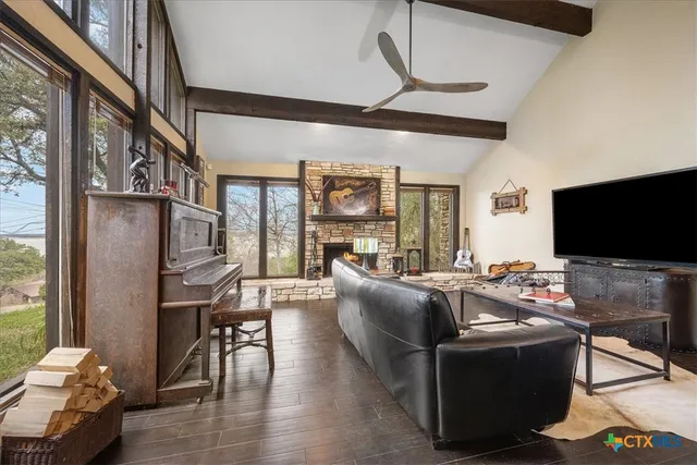 a bedroom with furniture and flat screen tv