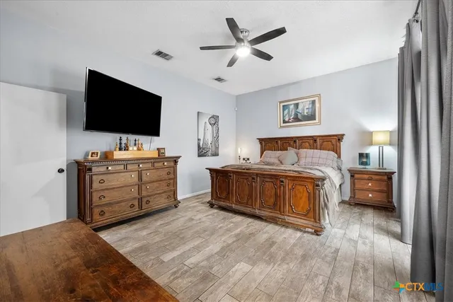 a view of living room with furniture and a flat screen tv