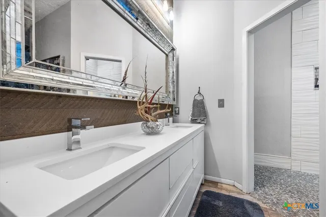 a bathroom with a toilet a sink and a window