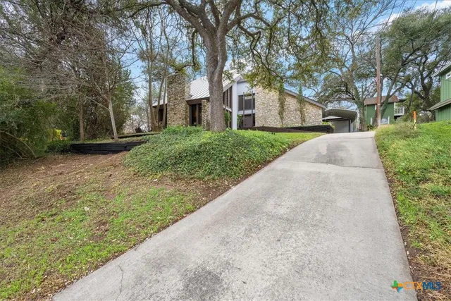 a view of a house with a street