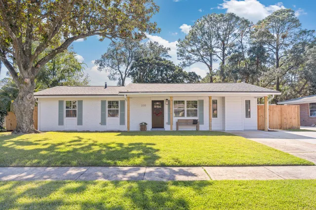 a view of a house with a swimming pool and a yard