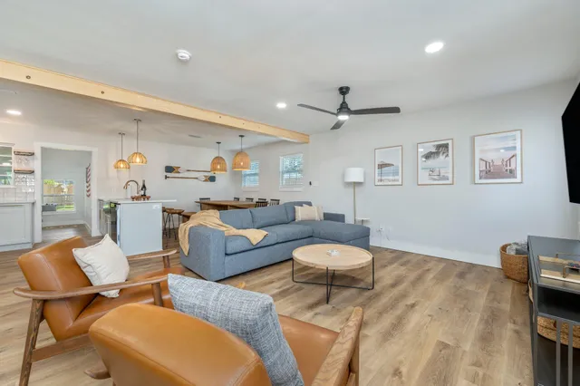 a kitchen with stainless steel appliances white cabinets and a stove top oven