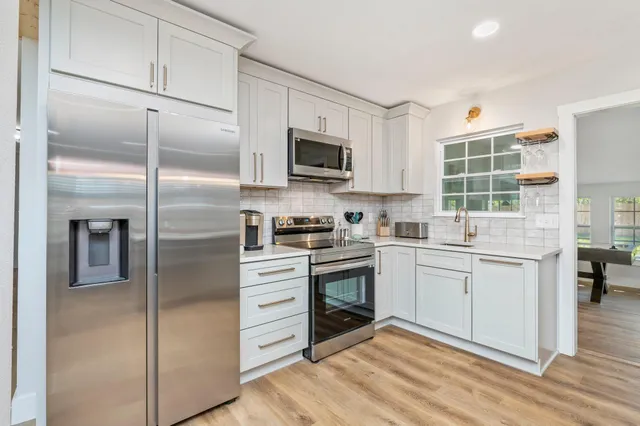a view of water heater room with a mirror