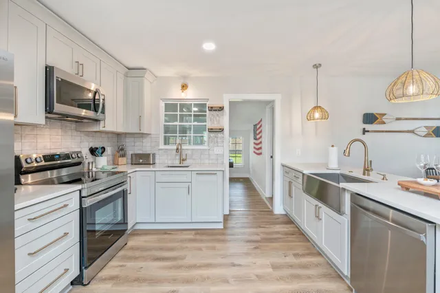 a blue chair sitting in a bedroom next to a window