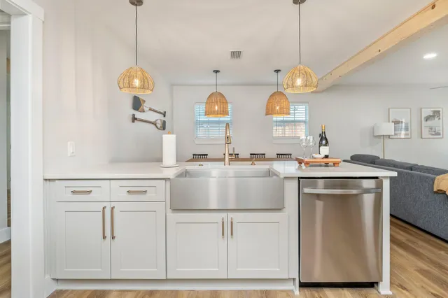 a bedroom with a bed and a flat tv screen on the dresser