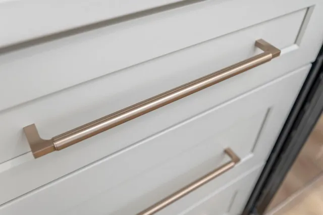 a bed sitting in a bedroom next to a larger window