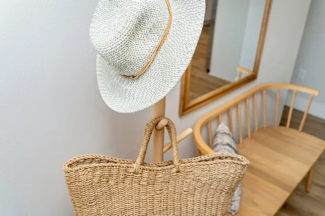 a room with pool table windows and wooden floor
