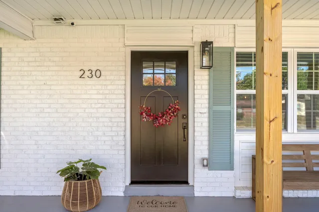 a view of a entryway door front of a house