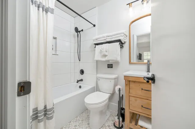 a view of a chairs and table in backyard