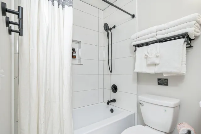 a view of a house with backyard porch and sitting area