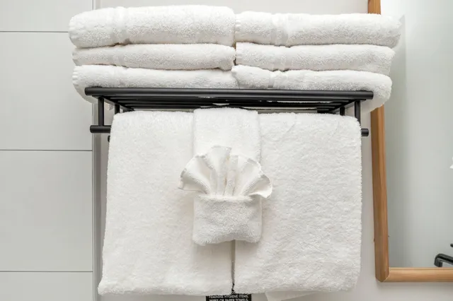 a view of a patio with table and chairs and potted plants