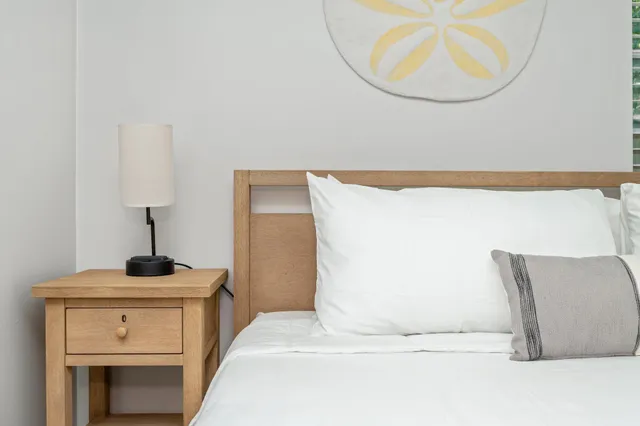 a view of a wooden house with a yard