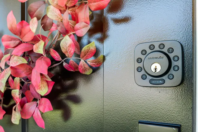 a living room with furniture a flat screen tv and kitchen view
